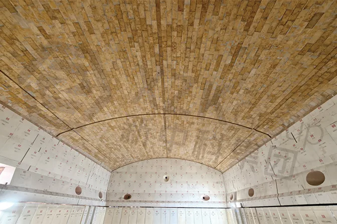 Furnace crown seen from below after bricking. The vault carries the full thermal load and has to resist alkali vapour at the same time.