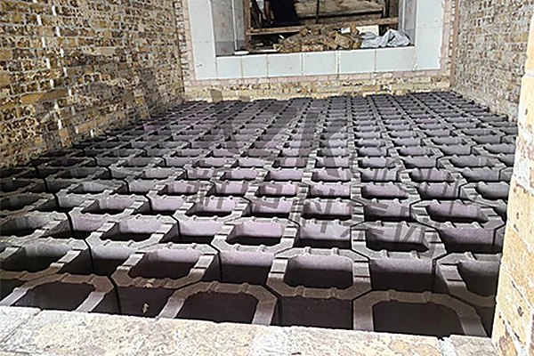Regenerator checkerwork — octagonal checker bricks laid to the chamber layout.