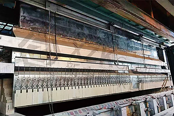 Suspended wall hanger beam during installation — no brick carries the weight of the brick above it.